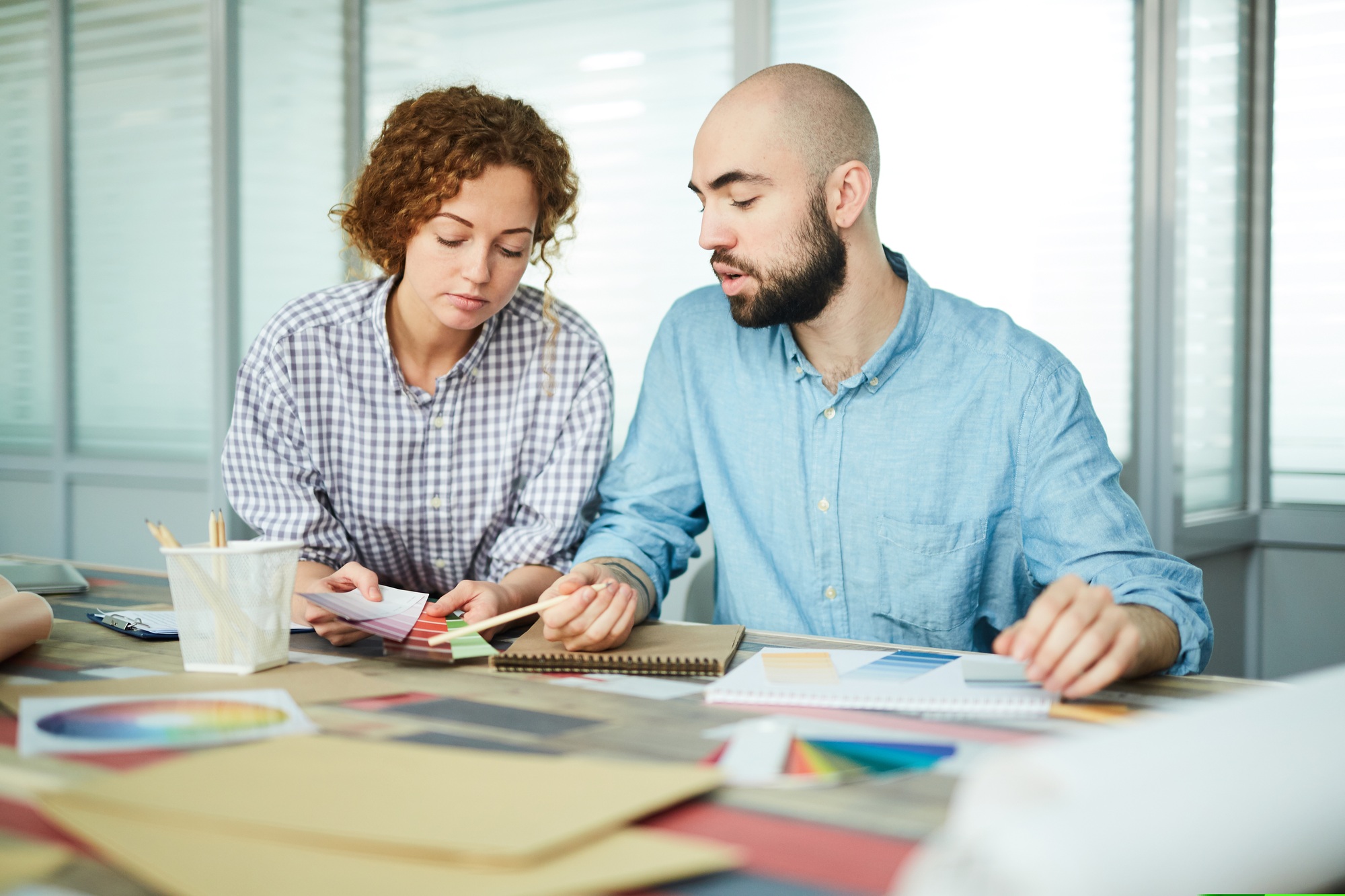 Color design specialists discussing color combination