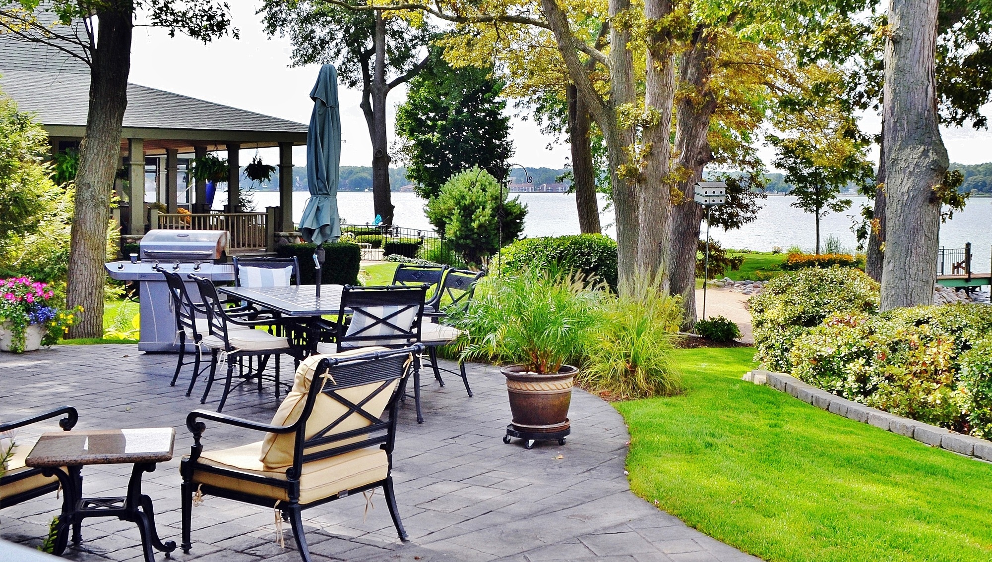 Patio outdoor living space on the lake with beautiful landscape design
